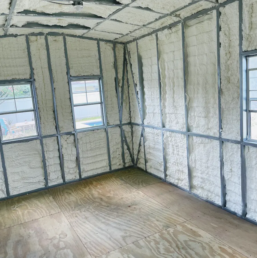 Closed-cell spray foam insulation applied to wall cavities in a residential project in North Coventry